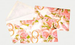 Kāzu papīra aploksne ar rozēm un gredzeniem